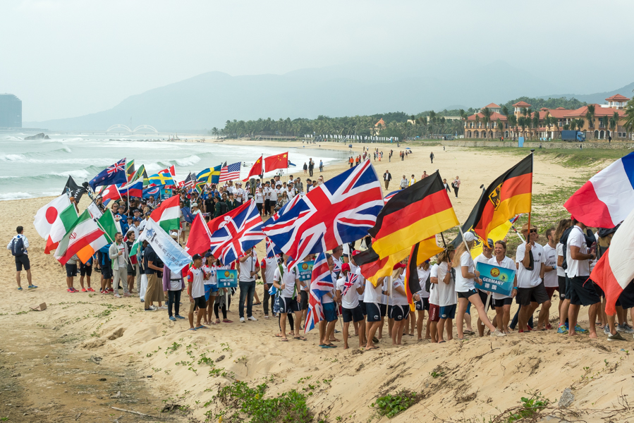 The Parade of Nations marches down the beach of Riyue Bay in Wanning, China. Photo: ISA / Sean Evans 