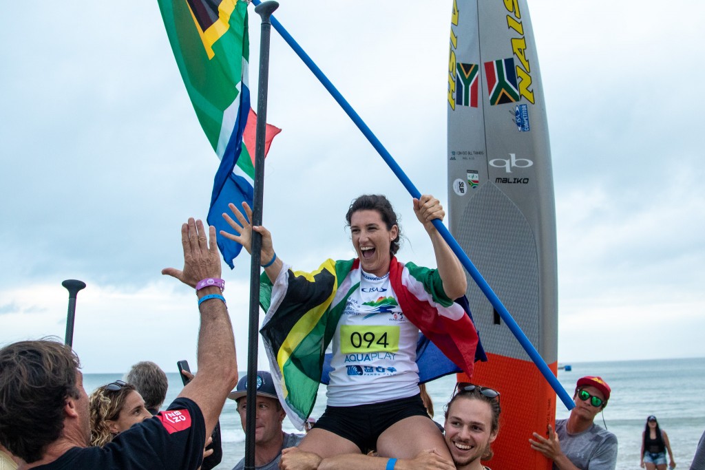 Tarryn King rejoices after earning a historic first-ever SUP Gold Medal for Team South Africa. Photo: ISA / Pablo Jímenez 