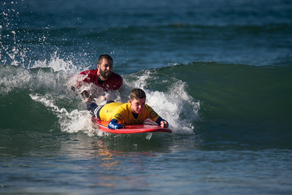 Getting the future generation of adaptive surfers involved in the sport at the ISA Adaptive Surfing Clinic presented by Junior Seau Foundation Adaptive Surf Program. Photo: ISA / Sean Evans 
