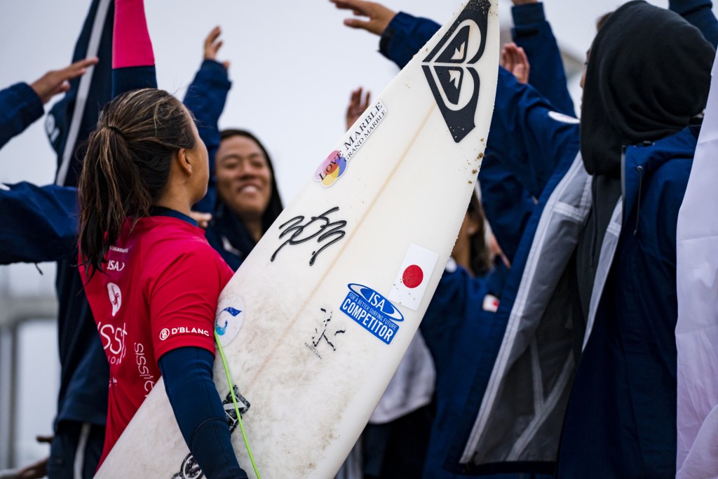 Team Japan shows support for a strong showing from Julie Nishimoto. Photo: ISA / Ben Reed 